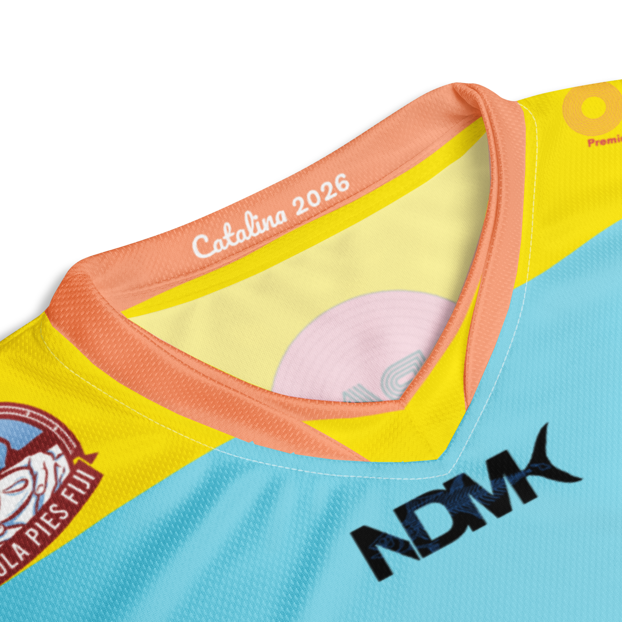 Close-up of a colorful shirt with text and logos on a white background